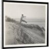 Man jumping off sand dune by Curtis Moffat