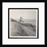 Man jumping off sand dune by Curtis Moffat