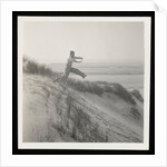 Man jumping off sand dune by Curtis Moffat