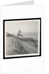 Man jumping off sand dune by Curtis Moffat