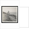 Man jumping off sand dune by Curtis Moffat