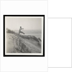 Man jumping off sand dune by Curtis Moffat