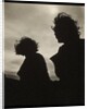 Silhouette of two women hair blown by wind sitting in wooden boat by Curtis Moffat