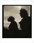 Silhouette of two women hair blown by wind sitting in wooden boat by Curtis Moffat