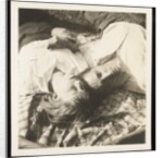 Man and woman lying head by head on rug on grass by Curtis Moffat